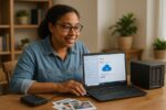 Person working on a computer while addressing external drive backup vs cloud backup