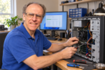 PCRuns owner-technician John Zettel diagnosing a desktop computer